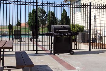 Outdoor community grill area of Castlerock Apartment Homes.